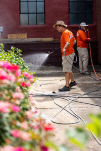 men cleaning concrete